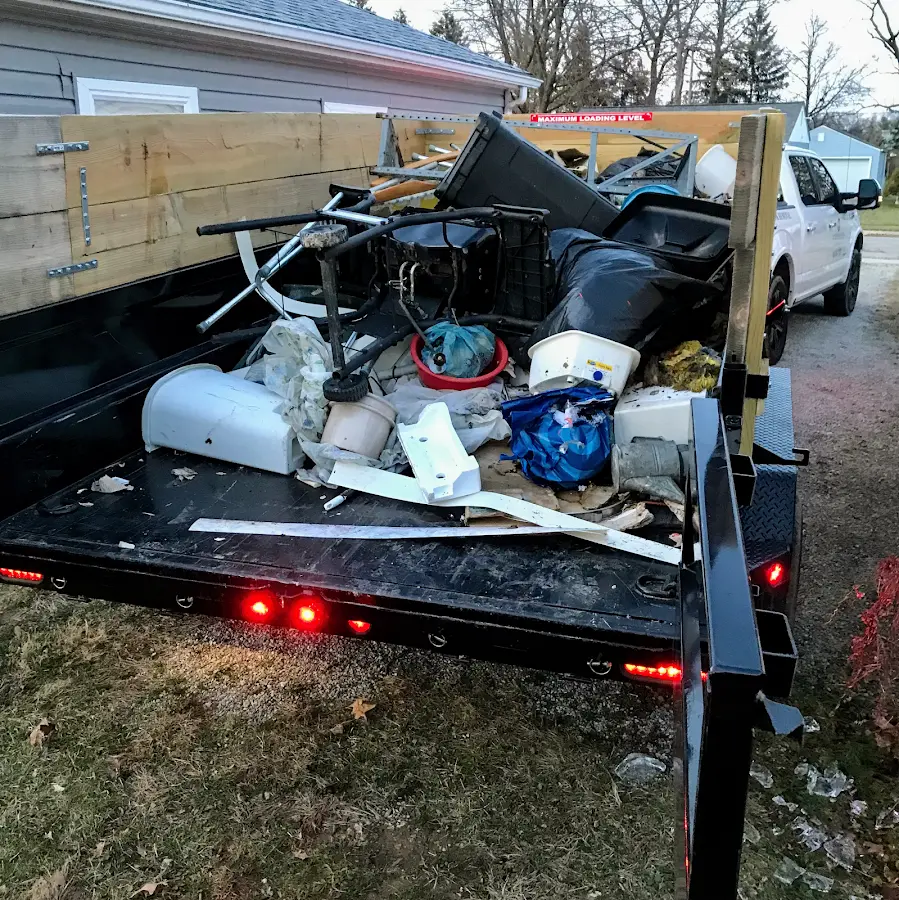 Roll-off dumpster delivered to a residential driveway in Kerman